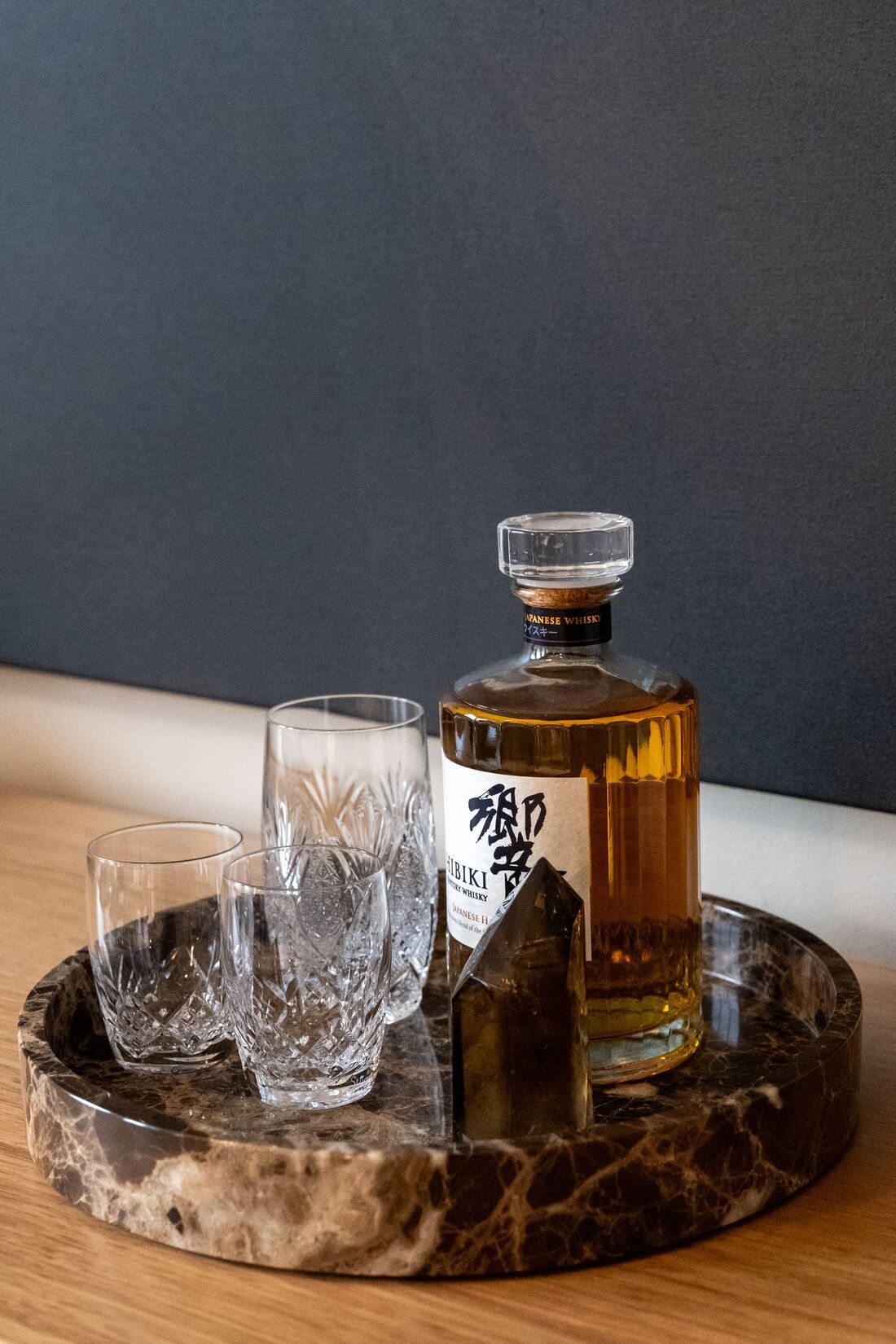 close-up of hibiki japanese whisky on a beautiful marble platter